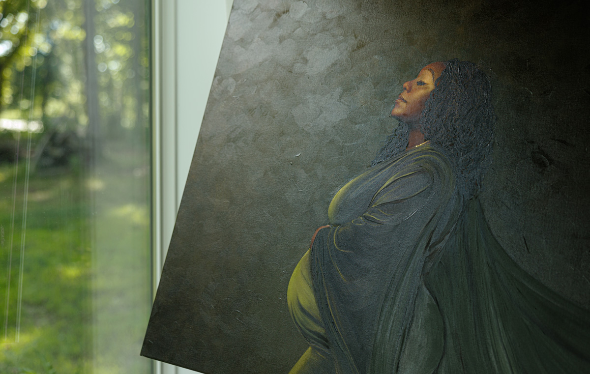 finished-oil-painted-canvas-portrait-des-moines Finished oil-painted canvas portrait of a pregnant woman, showing visible brushwork and texture, by Anj Portrait Studio in Des Moines